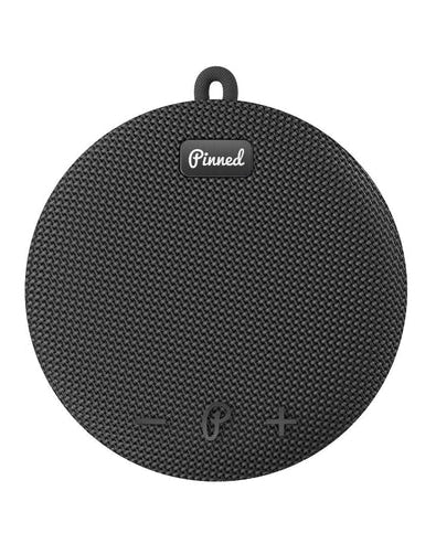 Black portable speaker with 'Pinned' branding on a white background