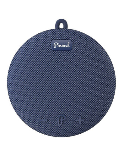 Blue textured Bluetooth speaker with 'Pinned' branding on a white background
