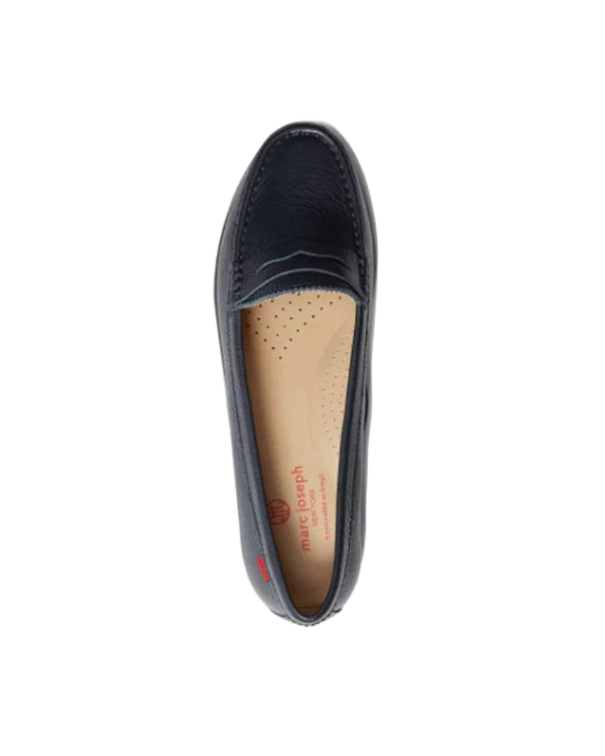 Navy blue flat shoe on a white background