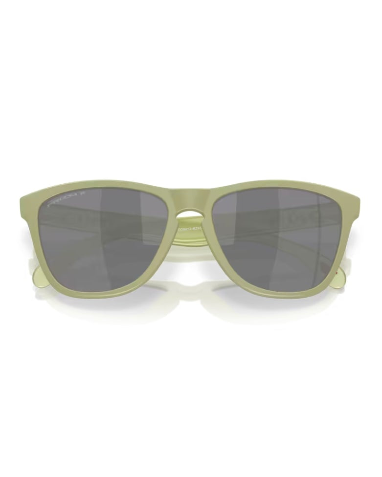 Sunglasses with green frame and dark lenses on a white background