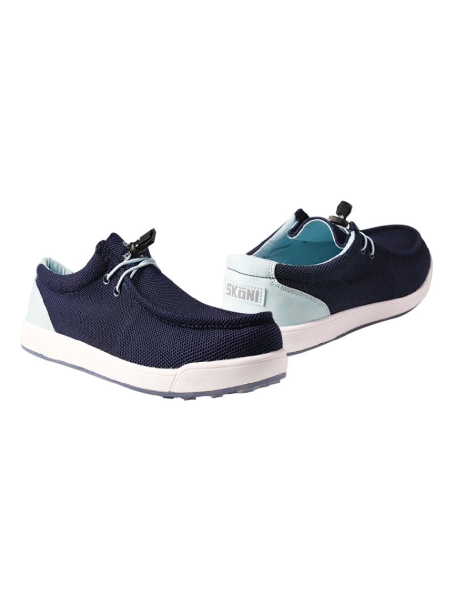 Navy blue and white shoes on a light gray background