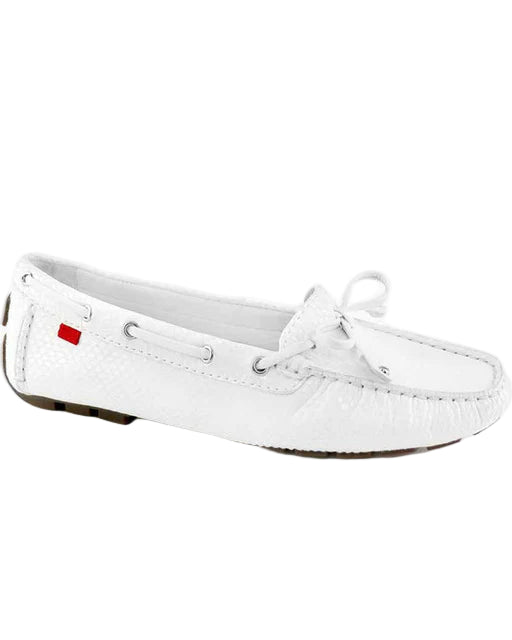 White boat shoe with a red label on a white background